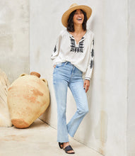 Load image into Gallery viewer, Effortlessly stylish, the Karen Kane Charlee Cream and Black Embroidered Peasant Top offers a timeless blend of charm and comfort. Crafted from lightweight cotton for a breathable, breezy feel, this top features intricate floral embroidery and a flattering split neckline. The voluminous blouson sleeves add a touch of elegance, making it versatile enough for casual days or polished evenings.