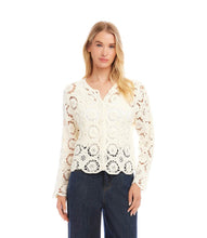 Load image into Gallery viewer, Woman wearing a cream crochet jacket and blue jeans on a white background.