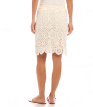 Load image into Gallery viewer, Embrace timeless elegance with the Crochet Skirt in Natural by Karen Kane. Crafted from premium cotton and adorned with intricate hexagon embroidery, this skirt is a perfect blend of sophistication and comfort. Its A-line silhouette and elastic waistband ensure effortless wearability, while its versatility makes it ideal for casual outings or dressed-up occasions. Add a touch of charm to your wardrobe with this beautifully designed piece.