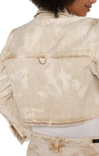 Load image into Gallery viewer, Add this fabulous, cropped denim layering piece to your entire look to add an edge to your outfit. Cropped at the waist, our Cynthia is the perfect length for versatility. The frayed hem and tie dye wash makes this unique style a fantastic choice for any outfit. For an effortless look, layer over an easy knit top with a looser fitting bottom for the perfect silhouette. Color - Bisquit Tan Tie Dye; washed light tan. Tie dye Silver buttons and hardware. D-ring on back. Crop style.