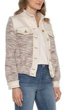 Load image into Gallery viewer, This jacket showcases a stunning combination of slight fray denim and boucle knit. The blend of textures, complemented by the earthy hues and gold metallic accents, creates a distinctive and adaptable garment that will surely be a go-to choice for your wardrobe. Color- Ecru Multi Boucle. 23-1/2" HPS. Gold button-front closure. Button cuffs. Two front flap pockets. Side welt pockets. Mixture of denim and boucle. Fray details at the seams.