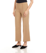 Load image into Gallery viewer, Close-up of model wearing beige cropped pants and black flats against a white background.