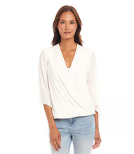 Load image into Gallery viewer, This sophisticated Drape Front Crossover Top is ideal for both professional and casual settings. Made with silky crepe material, it drapes elegantly and complements any silhouette. The crossover hem adds an element of flowing refinement, making it suitable for transitioning from day to evening wear.