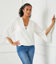 Load image into Gallery viewer, This sophisticated Drape Front Crossover Top is ideal for both professional and casual settings. Made with silky crepe material, it drapes elegantly and complements any silhouette. The crossover hem adds an element of flowing refinement, making it suitable for transitioning from day to evening wear.