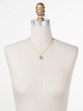 Load image into Gallery viewer, Elegant and captivating pendant necklace with a soft, pastel violet hue. Boasting a cushion-cut stone with a smooth, rounded edge, bordered by a charming, vintage-inspired design. The delicate chain features intricate ball detailing and an adjustable length of 16 inches, with a 4-inch extension for a perfect fit. Whether seeking a special gift or treating yourself, this artisan-crafted necklace offers a timeless and sophisticated option.
