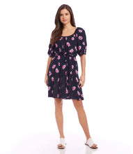 Load image into Gallery viewer, This colorful daisy print tiered dress is a simple breeze to don and style. An adjustable sash at the waist creates curves for an alluring fit. Color- Berry and navy. Daisy print. Knee-length. Scoop neck. Side pockets. Fabric - 100% Viscose.