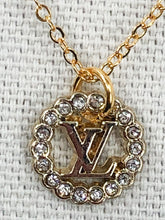 Load image into Gallery viewer, Perfect to wear alone or layer with other necklaces, this gorgeous Darcy vintage Louis Vuitton button on a shiny gold chain necklace will quickly become your go to. Perfect sparkle on our Darcy will catch the eye of admirers.