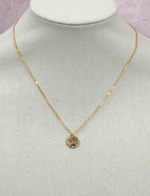 Load image into Gallery viewer, Perfect to wear alone or layer with other necklaces, this gorgeous Darcy vintage Louis Vuitton button on a shiny gold chain necklace will quickly become your go to. Perfect sparkle on our Darcy will catch the eye of admirers.