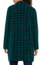 Load image into Gallery viewer, Introducing the Coatigan – a sophisticated blend of a coat and a cardigan. This mid-length coat is ideal for layering, accommodating both balmy nights and evening chills. Whether you are heading to the office, running errands, or enjoying a weekend brunch, this sweater coat serves as your perfect companion. It pairs well with denim, trousers, or leggings.