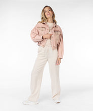Load image into Gallery viewer, This uniquely designed jean jacket is sure to turn heads. Its intricate embroidery adds a touch of femininity to the cool outerwear. Each embroidery features bronze crystals for extra shine.