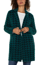 Load image into Gallery viewer, Introducing the Coatigan – a sophisticated blend of a coat and a cardigan. This mid-length coat is ideal for layering, accommodating both balmy nights and evening chills. Whether you are heading to the office, running errands, or enjoying a weekend brunch, this sweater coat serves as your perfect companion. It pairs well with denim, trousers, or leggings.