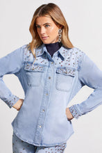 Load image into Gallery viewer, This striking sparkle and shine denim shirt perfectly brings together casual style with glamorous flair, adorned with striking rhinestone details in clear, pink, and red. It boasts a snap-up front, long sleeves with open cuffs, a crisp collar, and practical chest pockets, making it as functional as it is fashionable. 