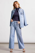 Load image into Gallery viewer, This striking sparkle and shine denim shirt perfectly brings together casual style with glamorous flair, adorned with striking rhinestone details in clear, pink, and red. It boasts a snap-up front, long sleeves with open cuffs, a crisp collar, and practical chest pockets, making it as functional as it is fashionable. 