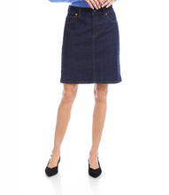 Load image into Gallery viewer, Model wearing a dark blue denim skirt, blue top and black heels against a white background.