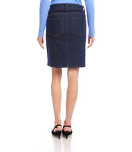 Load image into Gallery viewer, Model wearing a dark blue denim skirt, blue top and black heels against a white background.