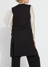 Load image into Gallery viewer, Crafted from 4-way stretch Ponte fabric, the Denver Ponte Sleeveless Coat is a classic piece ideal for the fall season. It complements the Denver Hi Waist Wide Leg Ponte pants seamlessly and is easy to maintain. The coat is sleeveless, machine washable, and fits true to size. It is designed with Lightweight Vegan Leather accents, practical pockets, elevated back slits, and a demi-belt at the back. The interior is meticulously finished with Satin binding.