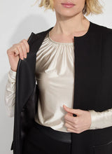 Load image into Gallery viewer, Crafted from 4-way stretch Ponte fabric, the Denver Ponte Sleeveless Coat is a classic piece ideal for the fall season. It complements the Denver Hi Waist Wide Leg Ponte pants seamlessly and is easy to maintain. The coat is sleeveless, machine washable, and fits true to size. It is designed with Lightweight Vegan Leather accents, practical pockets, elevated back slits, and a demi-belt at the back. The interior is meticulously finished with Satin binding.