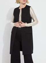 Load image into Gallery viewer, Crafted from 4-way stretch Ponte fabric, the Denver Ponte Sleeveless Coat is a classic piece ideal for the fall season. It complements the Denver Hi Waist Wide Leg Ponte pants seamlessly and is easy to maintain. The coat is sleeveless, machine washable, and fits true to size. It is designed with Lightweight Vegan Leather accents, practical pockets, elevated back slits, and a demi-belt at the back. The interior is meticulously finished with Satin binding.