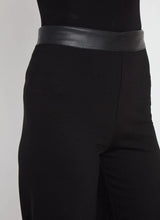Load image into Gallery viewer, The Denver Hi Waist Wide Leg Ponte pant offers a high waist, welt back pockets and a concealed patented waistband. These pants are constructed without side seams for a lengthening, flattering fit and offer a shiny, lightweight vegan leather waist that contrasts with the rest of the pant, in matte, 4-way stretch Ponte. Machine washable, the Denver Hi Waist Wide Leg Ponte pant also features a raw-edge hem that’s simple to shorten. We love them styled with our matching Denver Ponte Sleeveless Coat. 