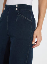 Load image into Gallery viewer, The Dion Sailor Palazzo Denim Pant is a chic sailor-inspired piece, perfect for modern fashion enthusiasts. This cropped wide-leg palazzo pant boasts trendy contrast-color topstitching and is crafted from premium 4-way stretch Knit Denim for comfort and flexibility. Featuring a clean front with a stylish waist seam, functional pockets adorned with metal buttons and eyelets, and back welt pockets, this design combines practicality with elegance.