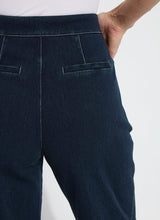 Load image into Gallery viewer, The Dion Sailor Palazzo Denim Pant is a chic sailor-inspired piece, perfect for modern fashion enthusiasts. This cropped wide-leg palazzo pant boasts trendy contrast-color topstitching and is crafted from premium 4-way stretch Knit Denim for comfort and flexibility. Featuring a clean front with a stylish waist seam, functional pockets adorned with metal buttons and eyelets, and back welt pockets, this design combines practicality with elegance.