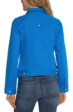 Load image into Gallery viewer, Enhance your wardrobe with a pop of vibrant color by adding this classic Diva Blue jean jacket. This versatile layering piece is made with comfortable fabric that maintains its shape. Perfectly complete any outfit by pairing it with its matching Hannah Crop Flare counterpart for a stylish and contemporary look. Color - Diva blue. Two front flap pockets. Two seam side pockets. 6-button front closure. Silver metal buttons. 23" HPS.