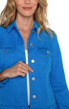 Load image into Gallery viewer, Enhance your wardrobe with a pop of vibrant color by adding this classic Diva Blue jean jacket. This versatile layering piece is made with comfortable fabric that maintains its shape. Perfectly complete any outfit by pairing it with its matching Hannah Crop Flare counterpart for a stylish and contemporary look. Color - Diva blue. Two front flap pockets. Two seam side pockets. 6-button front closure. Silver metal buttons. 23" HPS.