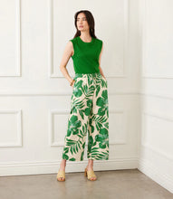 Load image into Gallery viewer, Woman wearing a green sleeveless tank and green and cream floral print drawstring pant posing against a white backdrop.