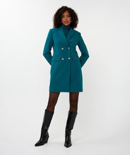Load image into Gallery viewer, Woman wearing a teal blazer dress, teal turtleneck and tall black boots against a white background.