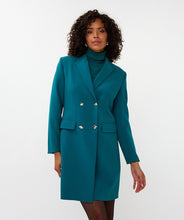 Load image into Gallery viewer, Woman wearing a teal blazer dress, and teal turtleneck against a white background.