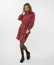 Load image into Gallery viewer, If you're in search of a dress with a distinctive, colorful print, our Sensation print dress is the perfect choice! It features a bow belt and buttons up to the waist. Crafted with an exterior of 100% polyester and a lining of 100% viscose, it not only maintains its beauty over time but also offers comfort.