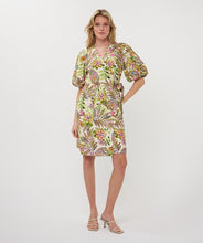 Load image into Gallery viewer, Woman wearing a colorful jungle print dress against a white background.