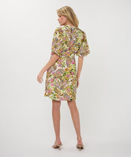 Load image into Gallery viewer, Woman wearing a colorful jungle print dress against a white background.