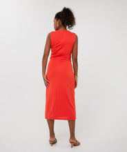 Load image into Gallery viewer, The EsQualo Dress Long Gathering is a stunning statement piece designed for effortless elegance and comfort. Featuring a vibrant red-orange hue, this midi length dress exudes warmth and sophistication, making it perfect for both casual and formal occasions.