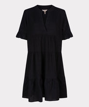 Load image into Gallery viewer, This short-sleeved dress boasts a loose fit and a floaty skirt, creating a hint of playfulness. Made from a waffle fabric, this dress is perfect for summertime, allowing for unrestricted movement and comfort.