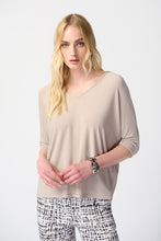 Load image into Gallery viewer, Discover the versatility of this reversible top, featuring a V-shaped neckline on one side and a round collar on the other. Perfect for any occasion, the contemporary design allows for effortless styling. With three-quarter dolman sleeves for added elegance and a relaxed fit, this top is both comfortable and chic.