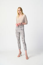 Load image into Gallery viewer, Discover the versatility of this reversible top, featuring a V-shaped neckline on one side and a round collar on the other. Perfect for any occasion, the contemporary design allows for effortless styling. With three-quarter dolman sleeves for added elegance and a relaxed fit, this top is both comfortable and chic.