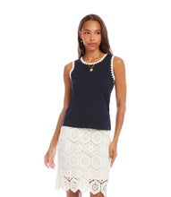 Load image into Gallery viewer, Woman wearing a navy sleeveless top with white crochet trim and a white lace skirt on a white background.