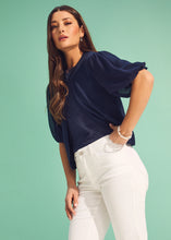 Load image into Gallery viewer, The FDJ French Dressing Eliana Elbow Sleeve Cardigan is a lightweight, stylish layer designed for effortless elegance. Featuring delicate puff short sleeves, a round neckline, and a delicate hook-and-eye closure, this cardigan offers a flattering silhouette that complements any outfit.