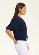 Load image into Gallery viewer, The FDJ French Dressing Eliana Elbow Sleeve Cardigan is a lightweight, stylish layer designed for effortless elegance. Featuring delicate puff short sleeves, a round neckline, and a delicate hook-and-eye closure, this cardigan offers a flattering silhouette that complements any outfit.