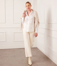 Load image into Gallery viewer, Enhance your closet with our expertly hand-embroidered embellished button up shirt. Delicately hand stitched flowers in a soft almond hue decorate this classic off white garment, adding a refined and sophisticated touch.