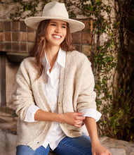 Load image into Gallery viewer, Enhance your closet with our expertly hand-embroidered embellished button up shirt. Delicately hand stitched flowers in a soft almond hue decorate this classic off white garment, adding a refined and sophisticated touch.