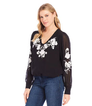 Load image into Gallery viewer, This elegant top will undoubtedly capture all the attention. Its stunning ivory floral embroidery on the black georgette fabric, is embellished with dazzling beads, while the sheer georgette blouson sleeves add extra sophistication. It's a versatile piece that can be dressed up or down for any occasion. A must-have for any wardrobe looking for an added touch of elegance.