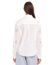 Load image into Gallery viewer, The Eden Embellished Button-Up Shirt by Karen Kane is a sophisticated and timeless piece designed to elevate your wardrobe. Featuring hand-embellished details, this shirt blends elegance with a relaxed fit for effortless styling. Crafted from laundered cotton poplin, it offers a breathable and lightweight feel, perfect for both casual and dressy occasions.