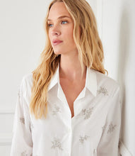 Load image into Gallery viewer, The Eden Embellished Button-Up Shirt by Karen Kane is a sophisticated and timeless piece designed to elevate your wardrobe. Featuring hand-embellished details, this shirt blends elegance with a relaxed fit for effortless styling. Crafted from laundered cotton poplin, it offers a breathable and lightweight feel, perfect for both casual and dressy occasions.