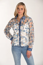 Load image into Gallery viewer, Woman wearing a floral lace blouse over a white cami and light blue jeans against a white background.