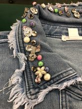 Load image into Gallery viewer, There's really no need to wear jewelry when you wear this fabulous denim shacket. The classic denim shacket gets a refreshing update this season with eye-catching rhinestone embellishments in all sorts of colors and shapes meticulously set on the collar and pockets. Wear this statement piece and be prepared to get noticed!