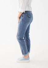 Load image into Gallery viewer, This jean is a must-have addition to any denim collection, with its charming embroidered hearts and eye-catching embellishments. In addition, slight distressing gives this jean extra edge! Color- Light blue. Embellishments. Slight distressing. Mid-rise. Button and zip fly. Low stretch.