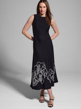 Load image into Gallery viewer, The Evelina Embroidered Knit Twirl Dress by Nic & Zoe is a stunning black with white detailing, fit-and-flare midi dress designed for effortless elegance. It features a round neckline, sleeveless design, and straight hem, making it a versatile choice for various occasions. The embroidered twirl knit fabrication adds a touch of sophistication, while the pullover construction ensures easy wear while the super-soft, drapey viscose knit creates a refined, dressy feel.
