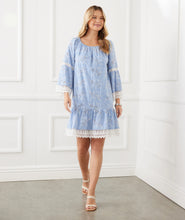 Load image into Gallery viewer, Our Ellie Embroidered Mixed Lace Dress features a romantic, billowy eyelit floral design with intricate embroider. Featuring a luxurious, figure-flattering silhouette, this dress offers a timeless look with modern styling. Perfect for any occasion, it will be sure to turn heads. Color- Chambray. Scalloped hem. Eyelit floral design. Lace inset. Fabric- 42% Polyester. 38% Rayon. 20% Linen.